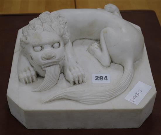 A Chinese carved white marble group of a Shishi and cub